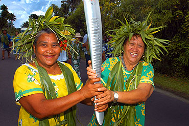 Nane and Kapiri. In Rarotonga, capital of the Cook Islands, Nane and Kapiri share responsibility for carrying the Queen's Baton.