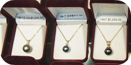 A selection of klassic black pearl necklaces presented by Goldmine