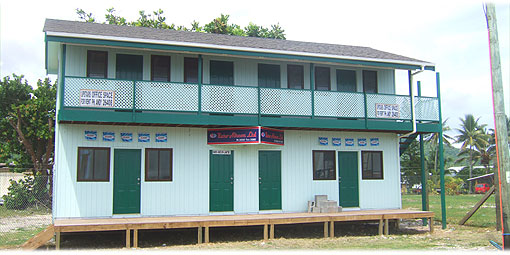 >>> View onto building in front of Timberland storage yard. Downstairs Raro Aircon Ltd.
